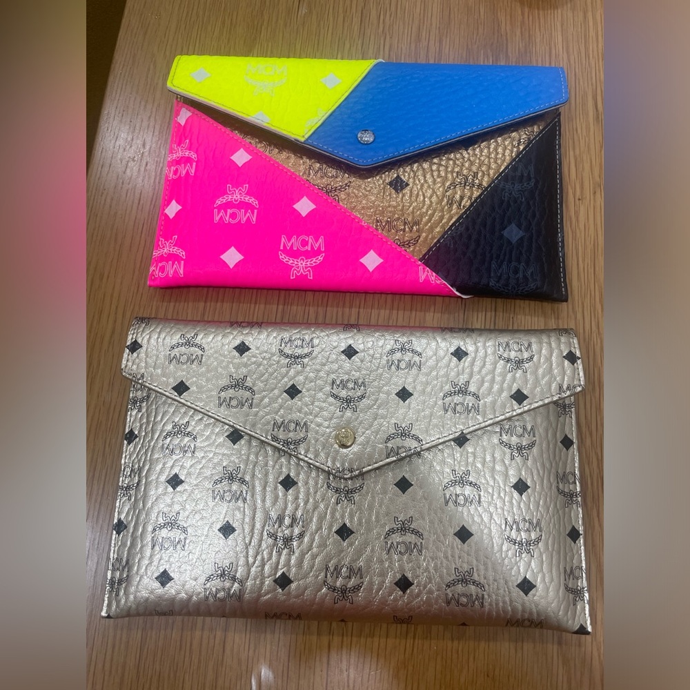 MCM Colorful Geometric Clutch and Gold clutch.
Come with dust bags